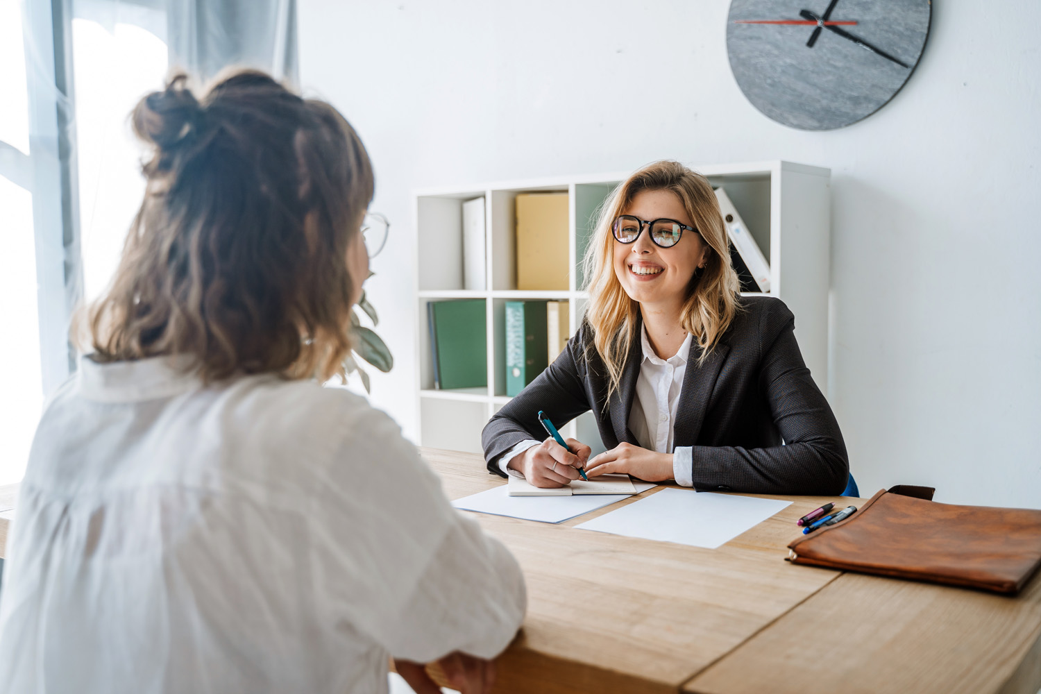 Young female candidate interviewed by employer